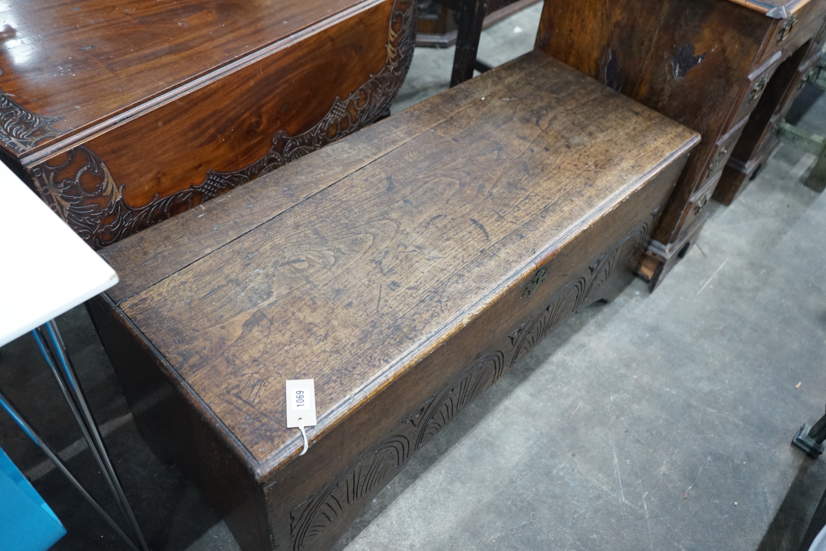 A late 17th / early 18th century carved six plank oak coffer width 115cms, depth 44cms, height 50cms.